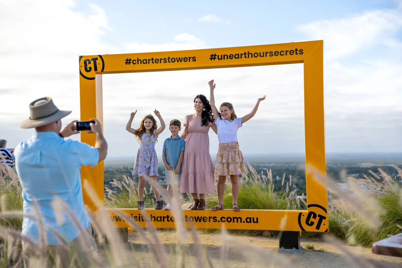 Family at the Charters Towers lookout frame, shot by me
